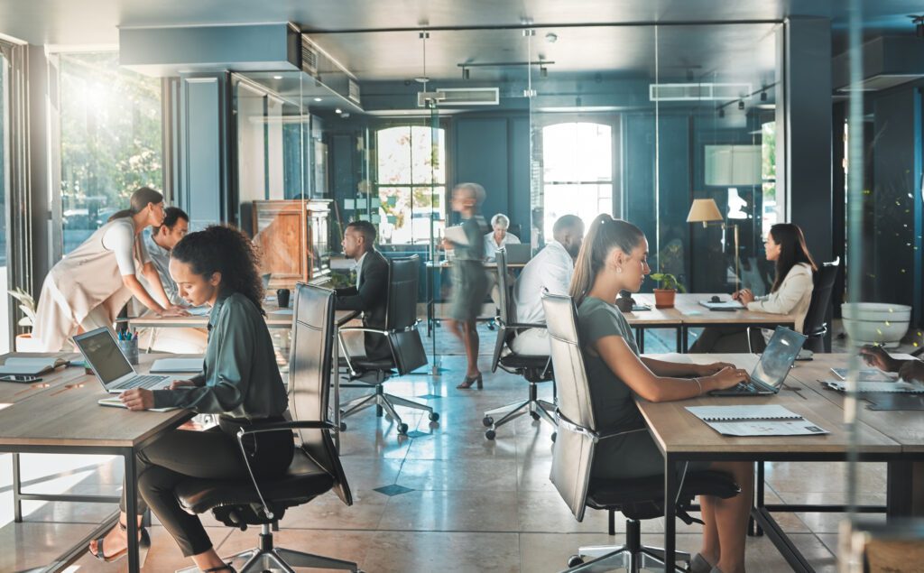 Employees working in a busy corporate office.