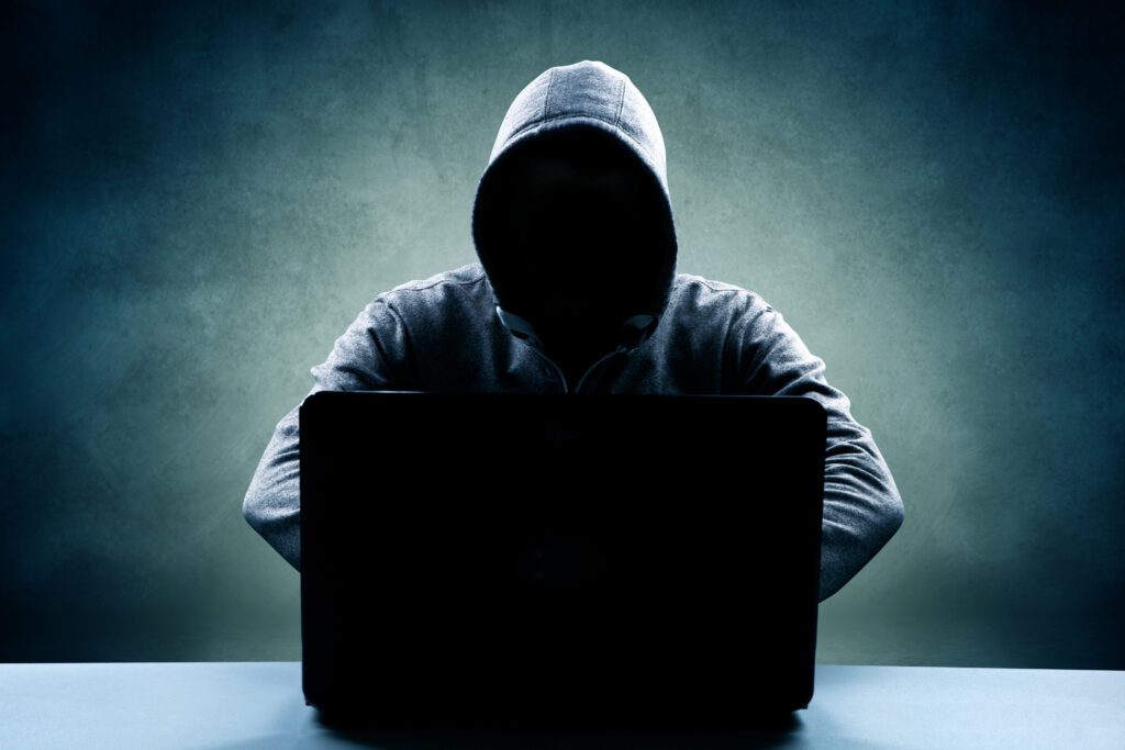 a hacker trying to take advantage of security gaps