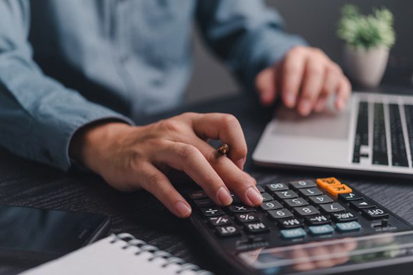 a man using a calculator