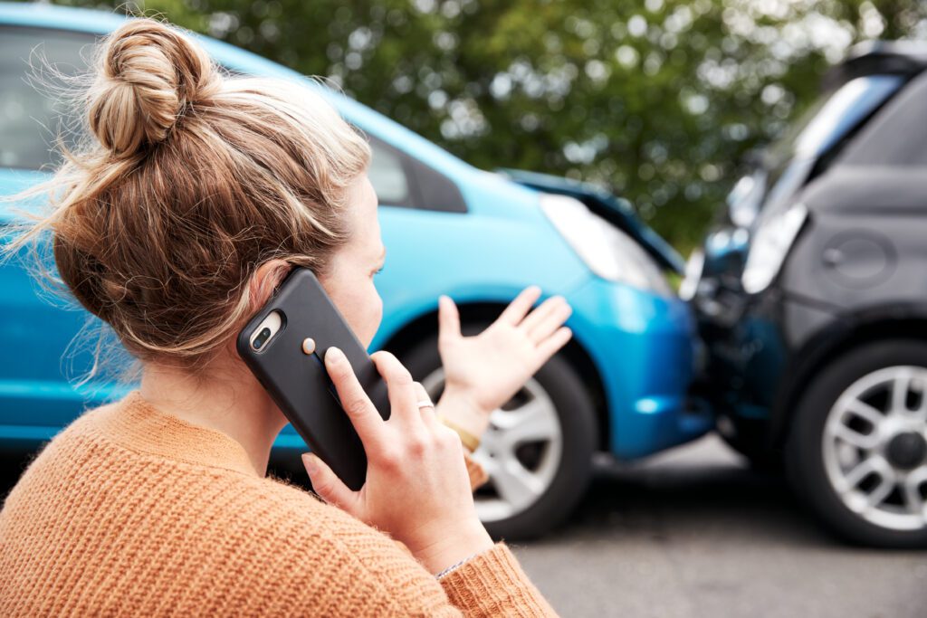 a woman calling her car insurance company